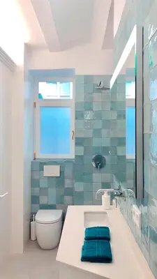 a bathroom with a sink and a toilet and a window at Apartamento Frederick “Centrico y con Clase” in Valencia