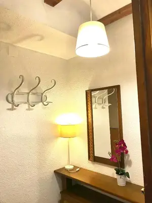 a bathroom with a mirror and a lamp and a mirror at Alto Palancia Calle Progreso 25 Sot de Ferrer in Sot de Ferrer
