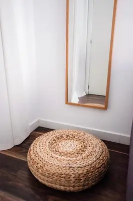 a round rug on the floor in a room with a mirror at Cool Loft Malvarrosa Beach in Valencia