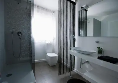 a bathroom with a sink and a toilet and a shower at Cool Loft Malvarrosa Beach in Valencia