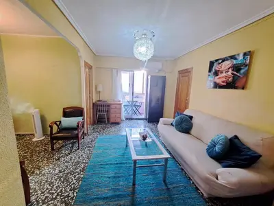 a living room with a couch and a table at Full equipped and comfortable apartment with WiFi in Valencia