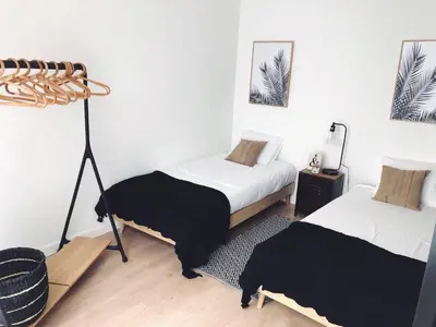 a bedroom with two beds with black and white sheets at Paz Velvet, Espectacular Piso en Calle La Paz in Valencia