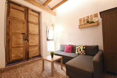 a living room with a couch and a table at Apartamento cerca de la playa in Valencia