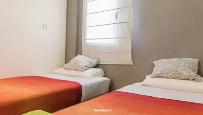 two beds sitting next to each other in a room at AA la Nueva Fe in Valencia