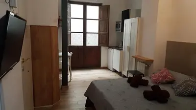 a small room with a bed and a window at PLAZA REDONDA brugada home in Valencia