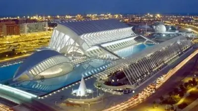 a large airport with a building with a lot of lights at Apto en Ciudad de las Ciencias y cerca playa in Valencia