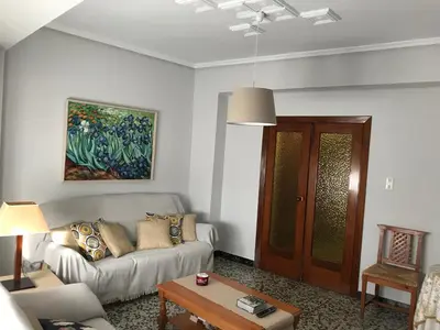 a living room with a couch and a table at Bonito piso en el centro de Benaguacil in Benaguacil
