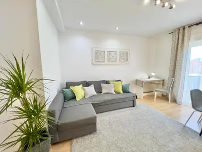 a living room with a couch and a table at Cozy apartment in Valencia! WI-FI ! in Valencia