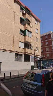 a car parked in front of a building at Se alquila una habitación doble con aire acondicionado in Valencia