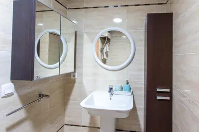 a bathroom with a sink and a mirror at Apartment on the beach,pool,WiFi,garage,Valencia in Valencia