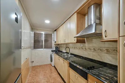 a small room with a bed and a desk and a table at Atarazanas Flat in Valencia