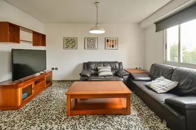a bedroom with a bed and a desk and a desk at Atarazanas Flat in Valencia