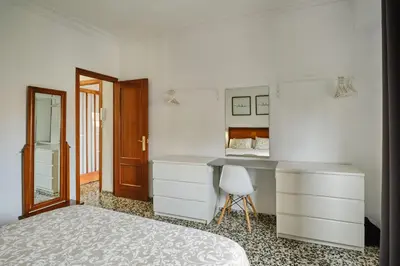a living room with a leather couch and a flat screen tv at Atarazanas Flat in Valencia