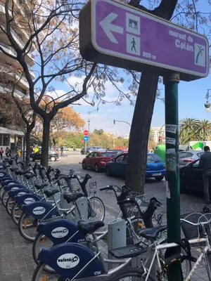 a bunch of bikes parked in a parking lot at Colón Market Downtown in Valencia
