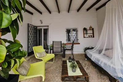 a living room with a bed and a couch at Penthouse Inlakesh in Valencia