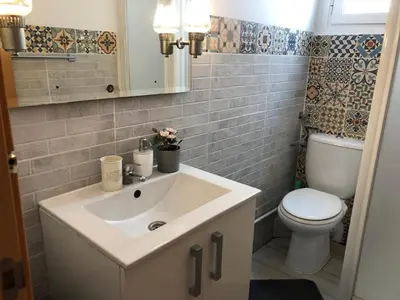a bathroom with a sink and a toilet at Apartment near the BIO PARC in Valencia