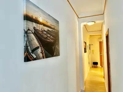 a hallway with a painting hanging on a wall at Apartment near the BIO PARC in Valencia