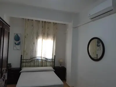 a bedroom with a bed and a window at Habitación San Cayetano in Valencia