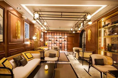 a living room with a couch and chairs and tables at MYR Palacio Vallier in Valencia