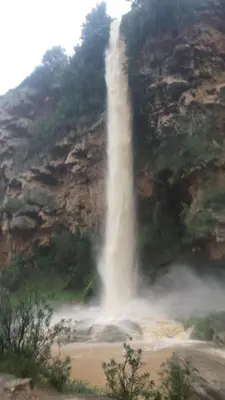 a waterfall on the side of a mountain at Apartamentos Chelo in Navajas