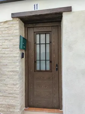 a wooden door on the side of a building at Casa Centro Jérica in Jérica