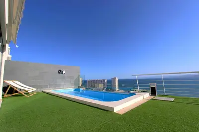 a swimming pool on the roof of a building at Can Lou-Casa con Caracter en Cullera in Faro de Cullera
