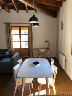 a living room with a table and chairs at Cozy en Blanch. Center in Valencia