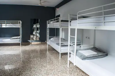 a room with two bunk beds in a room with blue walls at Quart Youth Hostel & Apartments in Valencia