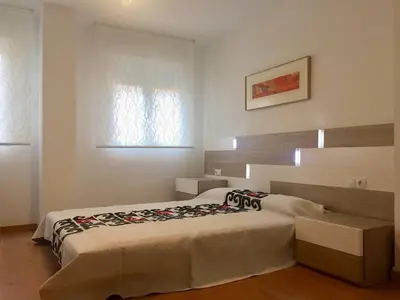 a bedroom with a large bed in a room at Apartamento en Universidad y cerca de la playa in Valencia