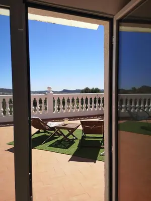 a view from the door of a balcony with a table and chairs at CASA MARTINEZ MONTROY à 3 kms de MONTSERRAT VALENCIA in Montroy