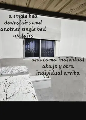 a bedroom with a bed and a window at Habitacion en casa de familia 