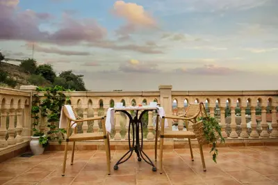 a table and two chairs on a balcony at Casa Ramos in Navarrés