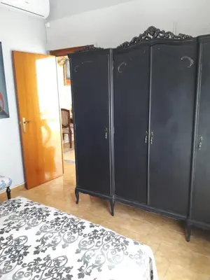 a group of black cabinets in a room at Carrer Roma in Sagunto