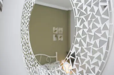 a mirror reflection of a bedroom with a bed in a room at SingularStays Puzol Beach VII in Puzol