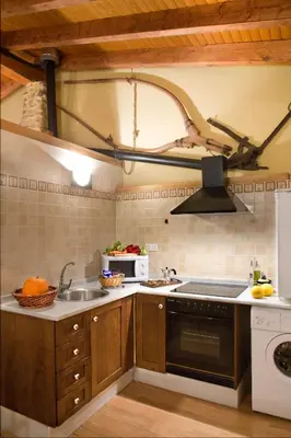 a kitchen with a sink and a stove top oven at Valterra y Tosal in Torres-Torres