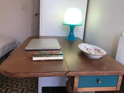 a table with a laptop and a bowl on it at Appartement Elsa Valencia in Valencia