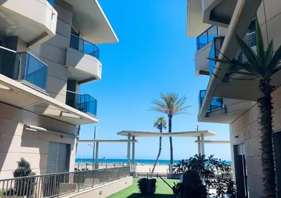 a view of the beach from the balcony of a building at PATACONA BEACH VISTAS AL MAR in Valencia