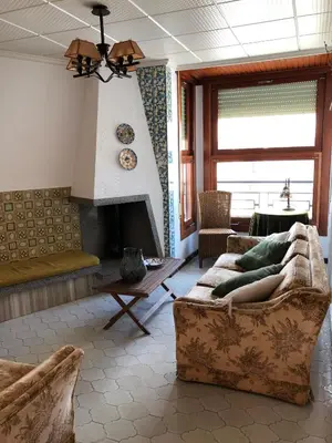 a living room with a couch and a fireplace at Casa Rural 