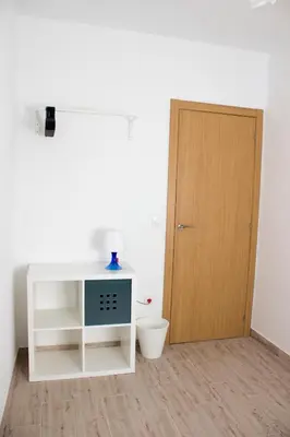 a room with a white desk and a wooden door at Campanar flat 2 in Valencia