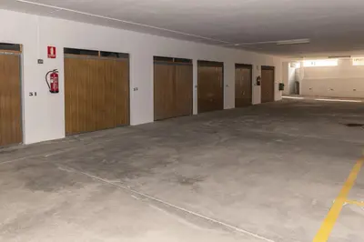 an empty room with lockers and a row of doors at AGUAMARINA C, 11-51 in Cullera