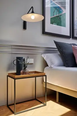 a bedroom with a bed and a table next to a couch at Room Mate Collection Helen Berger in Valencia