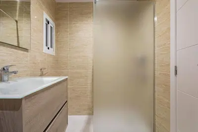 a bathroom with a sink and a shower at Garden Turia Downtown in Valencia