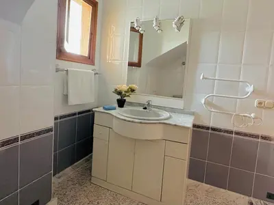 a bathroom with a sink and a mirror at Valencia Sol y Playa in Sagunto
