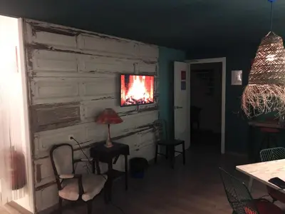 a living room with a wall with a fire in it at Art&Flats Hostel in Valencia