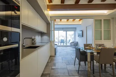 a kitchen and dining room with a table and chairs at FLORIT FLATS - CENTER MODERN 1BR 2Bth TERRACE WI-FI AC in Valencia