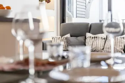 a dining room with a glass table and chairs at FLORIT FLATS - CENTER Luxurious 1BR 1BA Terrace WI-FI AC in Valencia