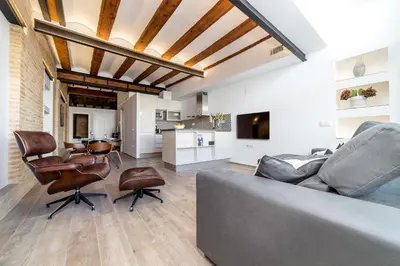 a rooftop patio with two couches and a table at FLORIT FLATS - CENTER Luxurious 1BR 1BA Terrace WI-FI AC in Valencia
