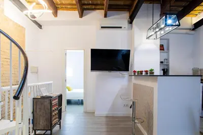 a living room with a flat screen tv on the wall at FLORIT FLATS - Cabanyal 3 Bedroom WIFI AC Terrace Beach Penthouse in Valencia