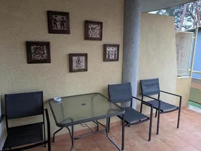 a glass table and chairs in a room at Apartamento zona residencial Montesol in La Eliana
