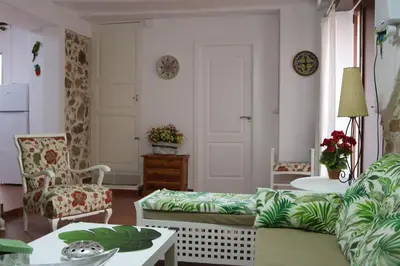 a living room with a couch and a table at Rosita Casa Rural in Estivella